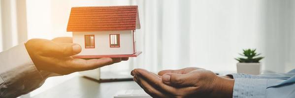 Real Estate Agent Handing Keys to Client